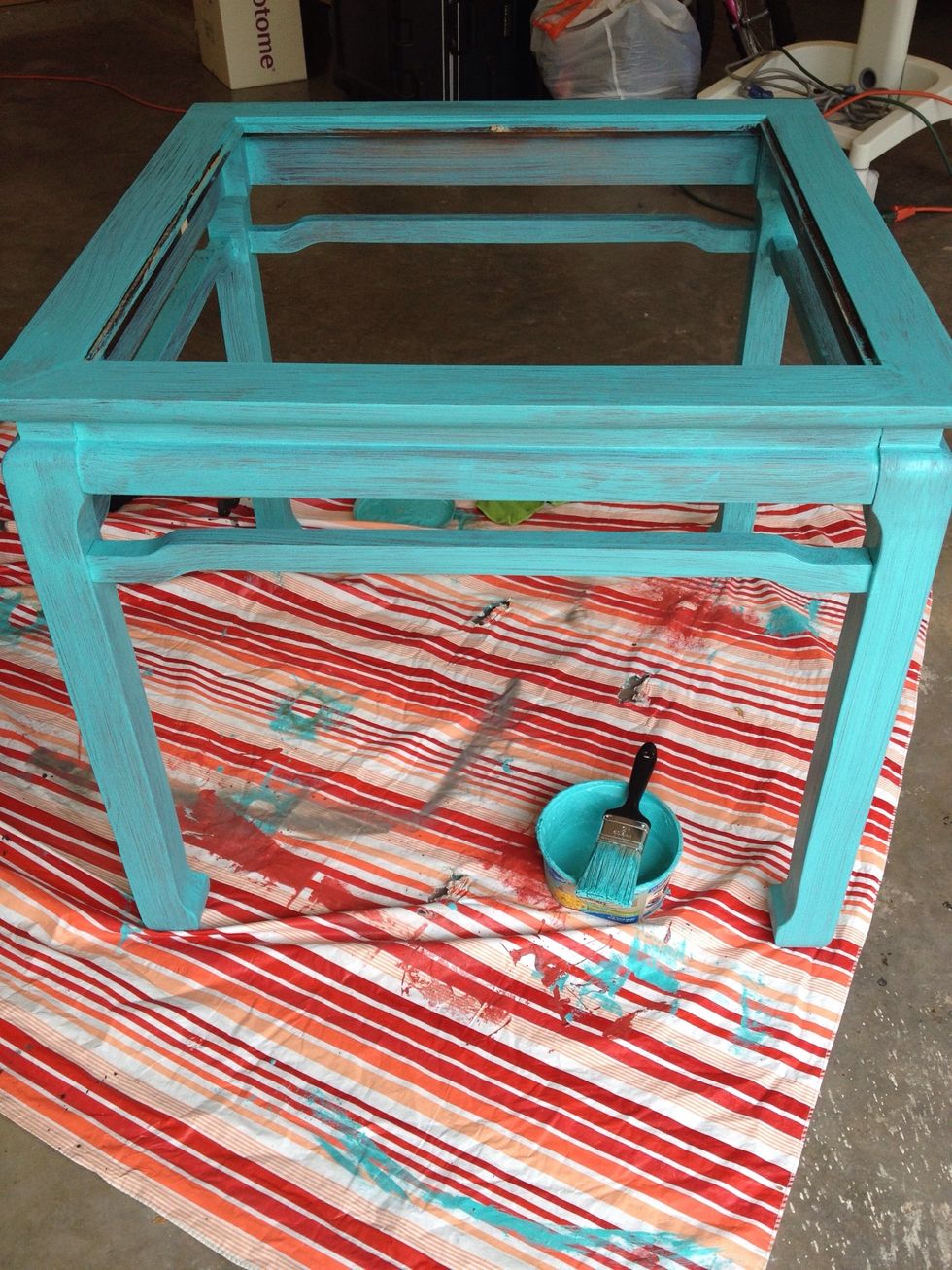 I applied chalk paint to entire table. You can still see a bit of the brown through the paint, but it will only add to distressed look later.