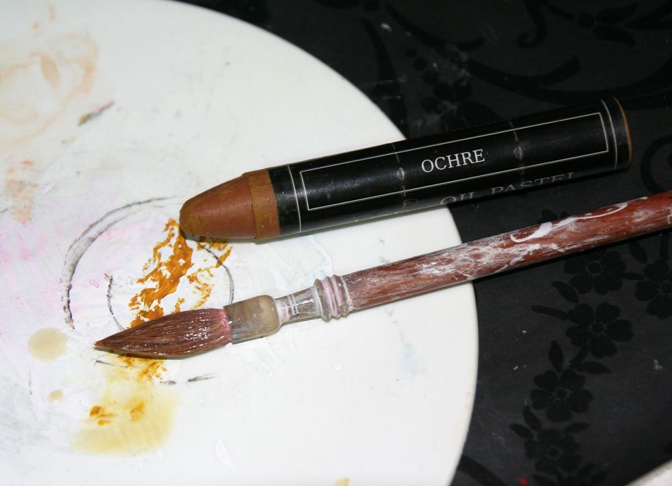 I applied Ochre Oil pastel on my palette + water.