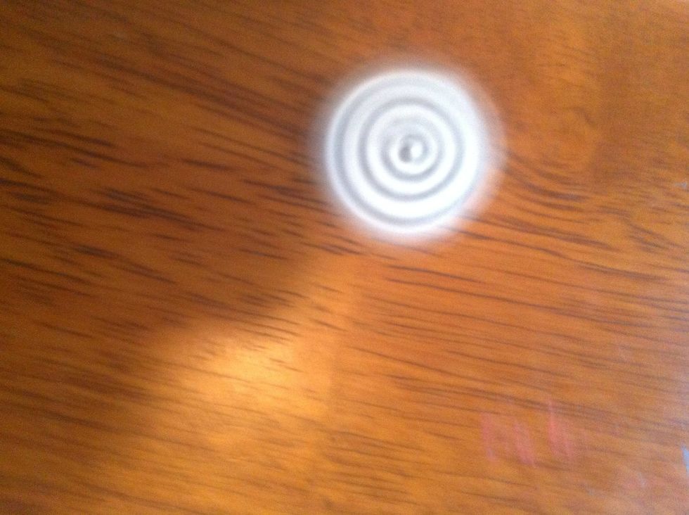 I assume spinning is self explanatory. Just in case... Place left thumb on one tip & right index finger on opposing tip. Move them quickly in clockwise direction while letting go. Lefties do opposite.