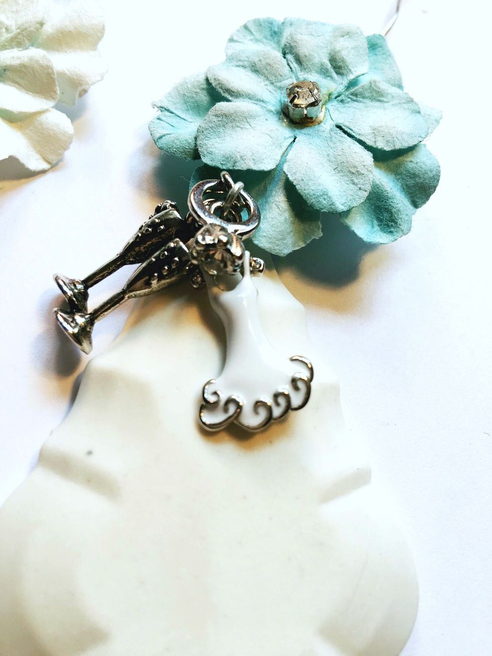 I attached my charms to the metal wire that holds the flower and the pendant together