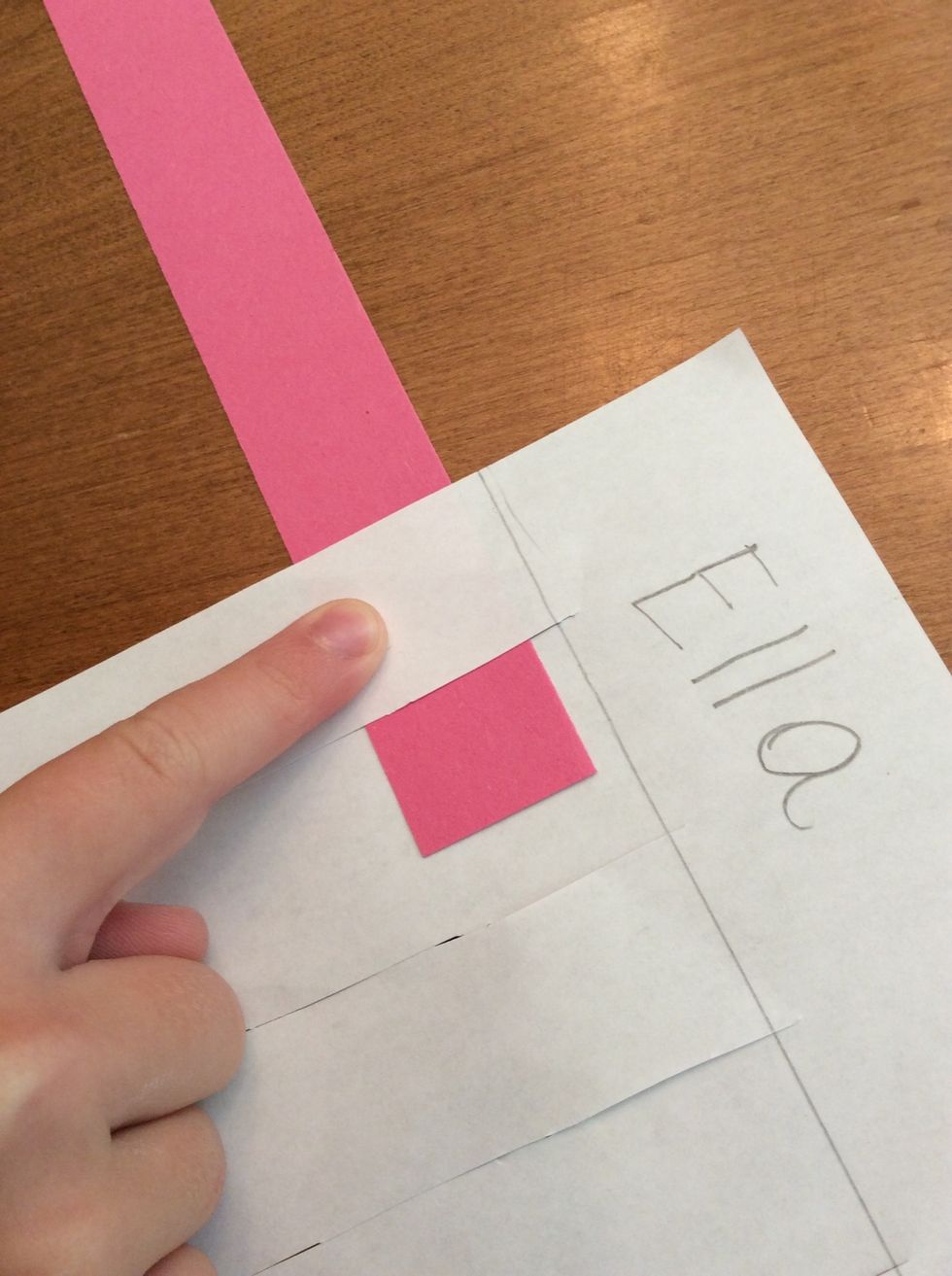 I begin by going under the paper with my strip.