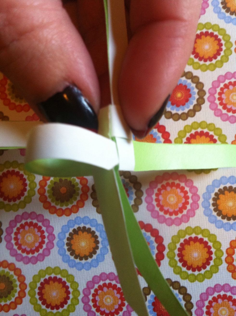 I bend mine back to wriggle & slide it in there.