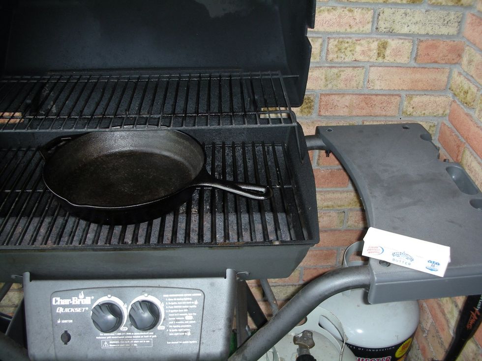 I blacken outside due to the smoke generated.  Heat the grill to medium a few minutes before taking the skillet out of the oven.  Set the butter out by the grill so it's ready to go in the skillet.