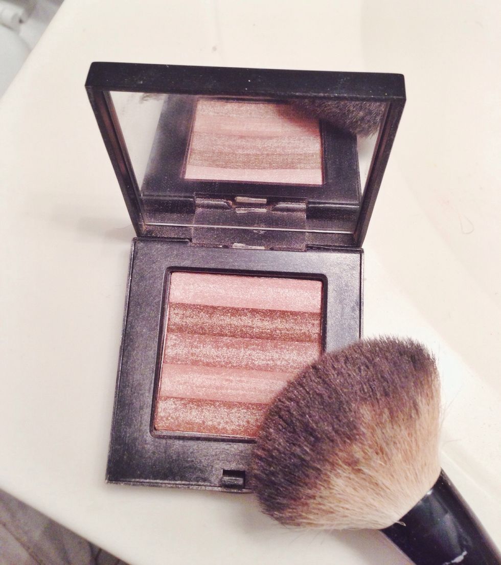 I blend all the colors together and tap brush before applying.