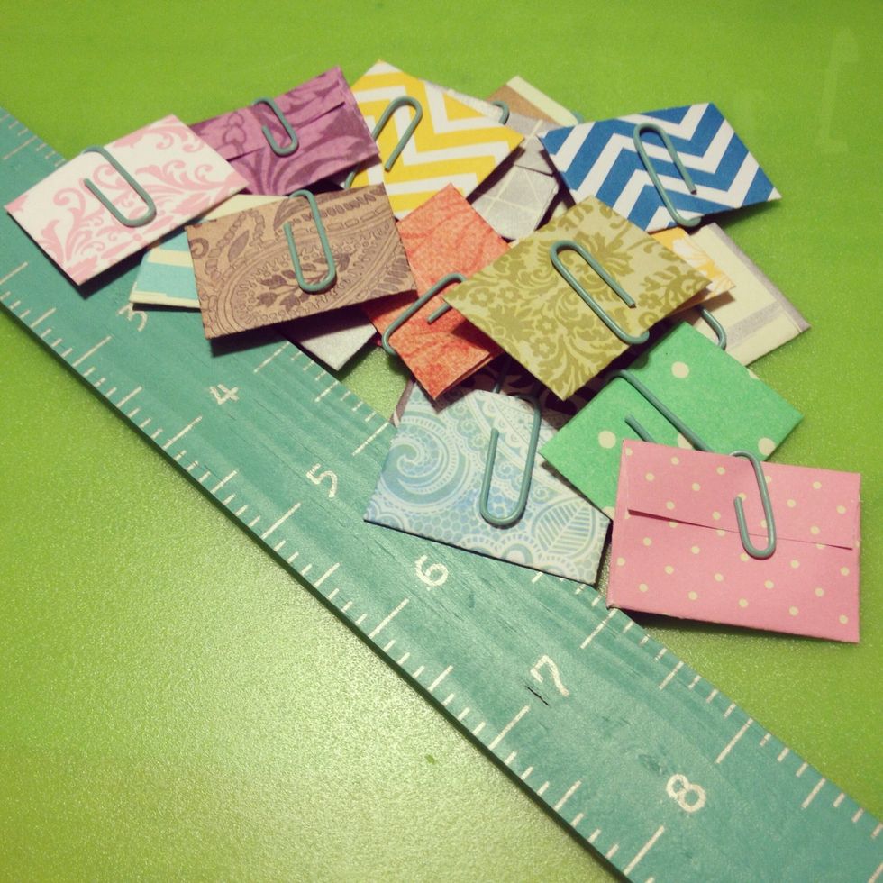 I bought 20 cent paper at Michael's and went to town! The possibilities are endless :) these ones have confetti that likes to fall out- hence the paper clips!