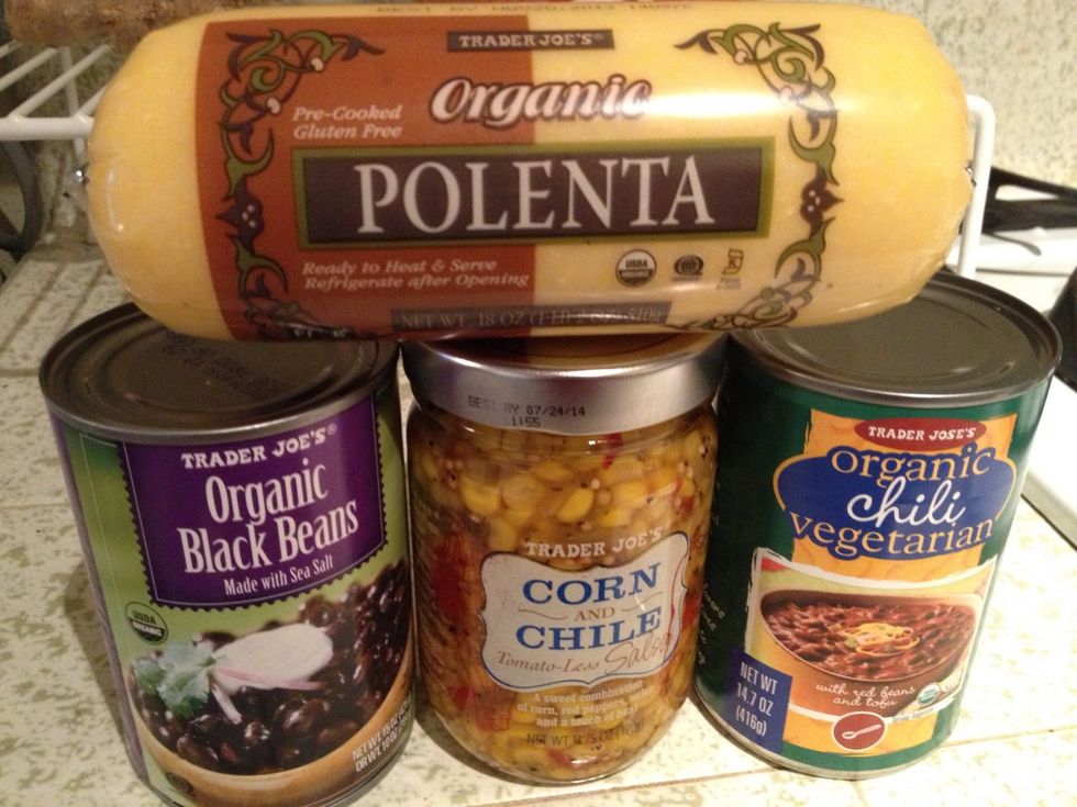 I bought all of these ingredients from Trader Joes. Preheat oven to 350 degrees. In large bowl, combine the corn & chile salsa, veggie chili, and the drained black beans.  Mix well and set aside.