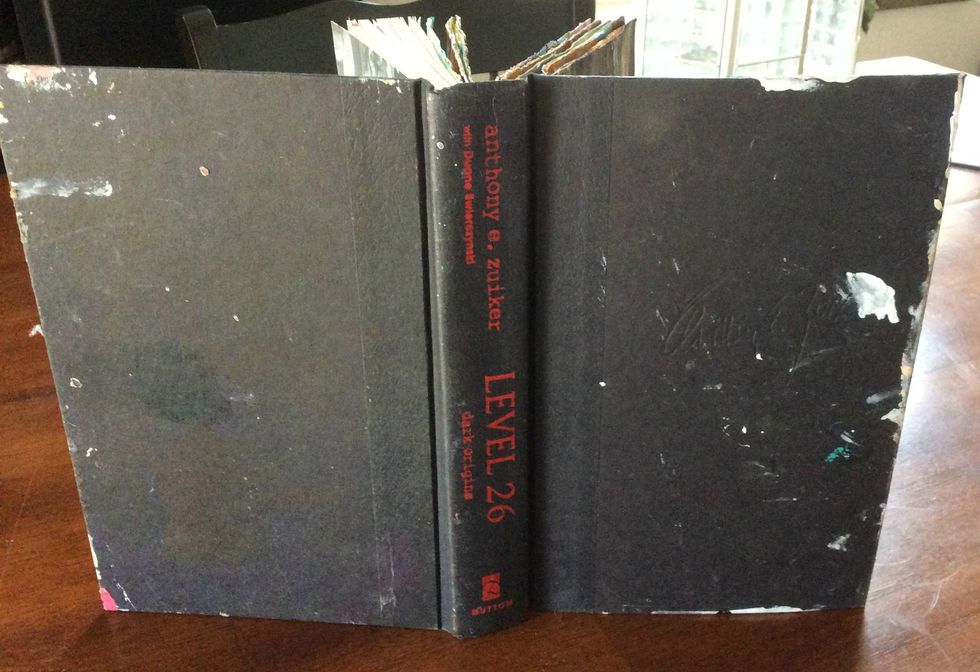 I bought this book at the $1 store, and it has become one of my art journals. But the cover needed a face lift.