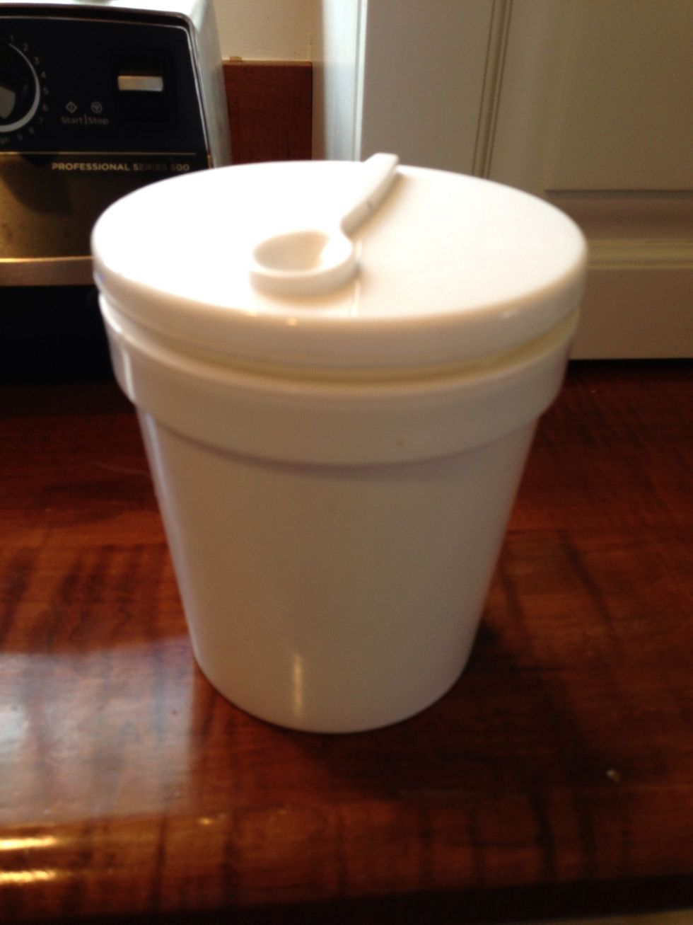 I bought this cute, insulated ice cream container at Sur la Tables recently. It holds about a pint and a half. You could use just regular Tupperware.