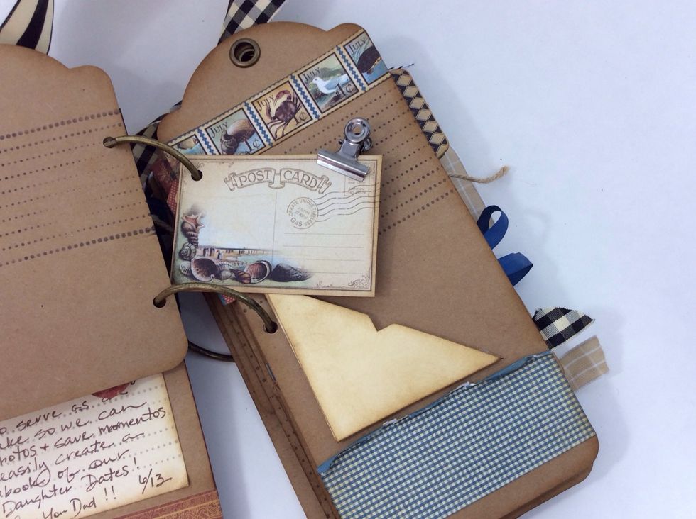 I bound my tags together with book rings. I then created a tag for each month, complete with a little pocket for a gift card or itinerary and journal lines/block to later fill in what we did.