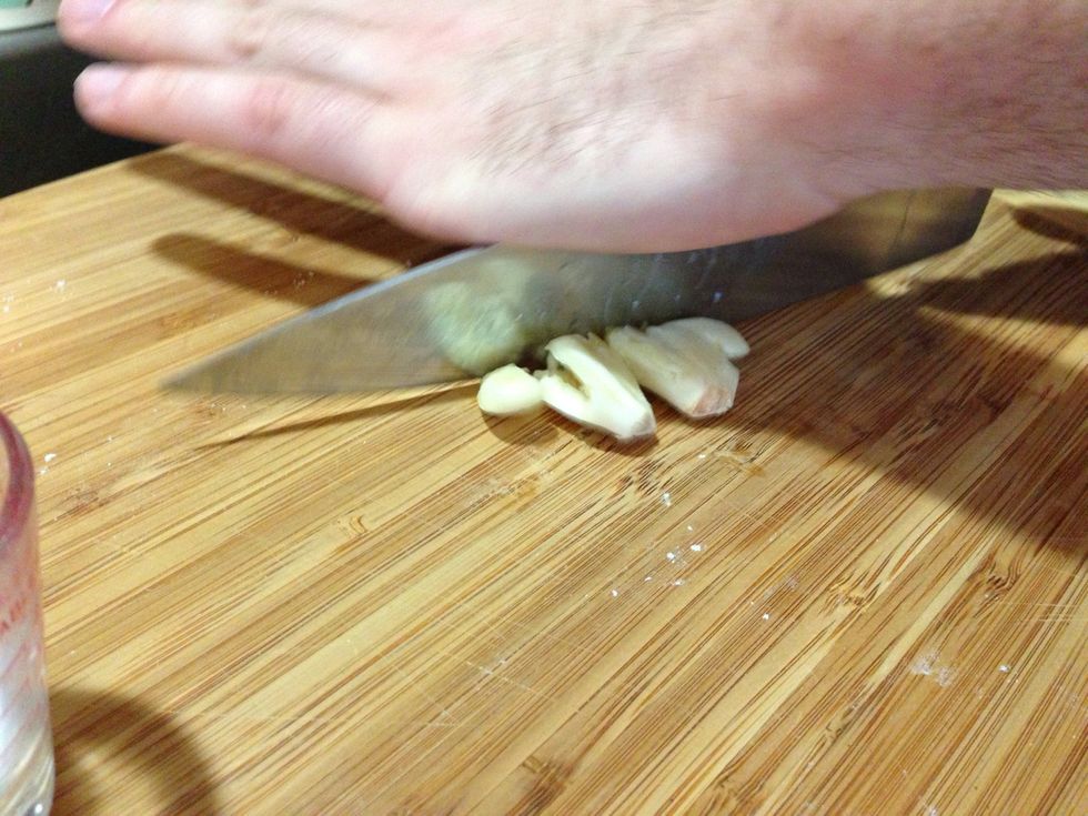 I can't chop like they do on TV. So I rest my hand on top the blade and rock it back-and-forth. I do this several times.