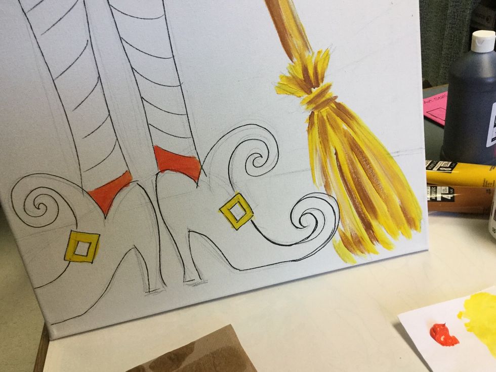 I chose for the stockings to be orange and black. Feel free to rearrange your color scheme. Begin painting the color at the ankle so you have contrast between stocking and boot!