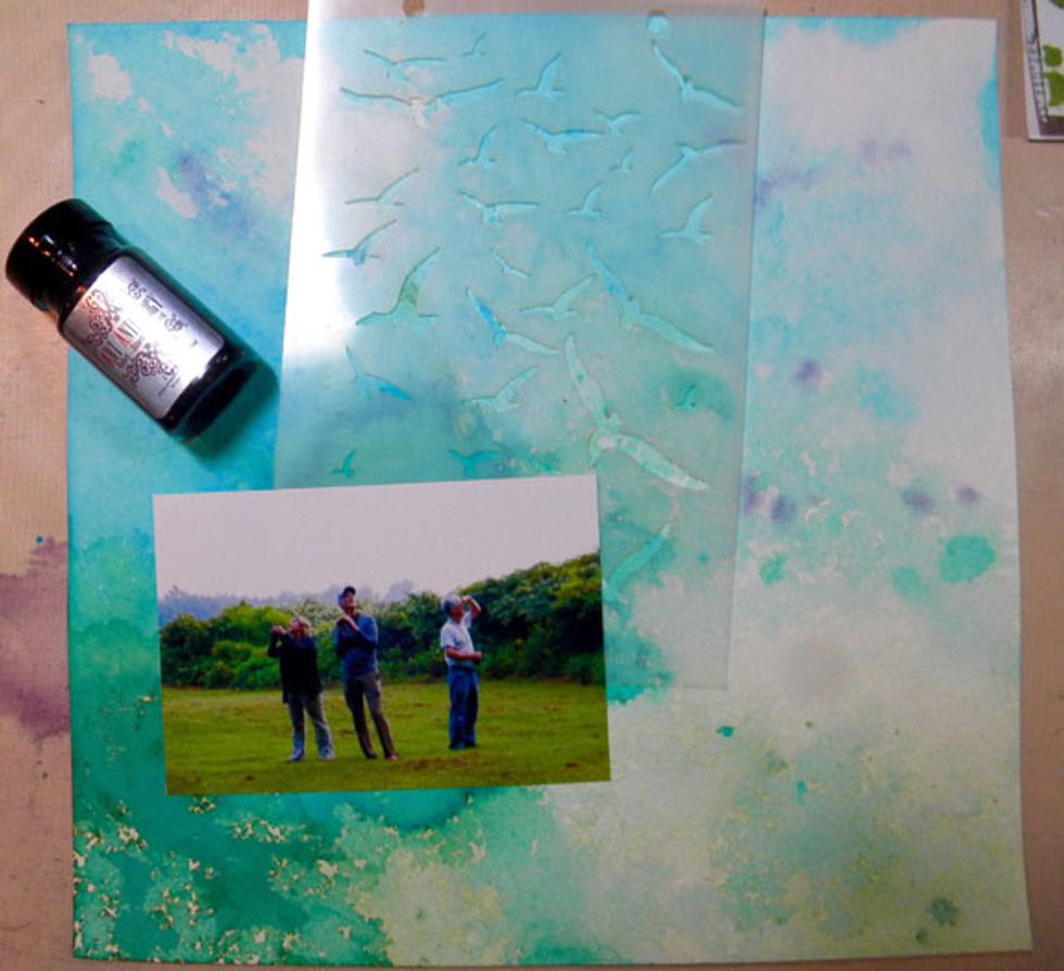 I chose one of the blue and green backgrounds to make a scrapbook layout using a photo of my brothers. I wanted to add birds to the "sky" using Tuxedo Velvet and the Take Flight stencil.
