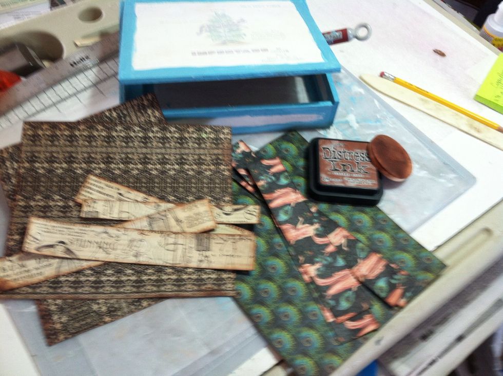 I chose papers from both the 12x12 and 8x8 pads. They were cut to size and distressed with Vintage Photo. I used a foam makeup sponge to apply the ink.