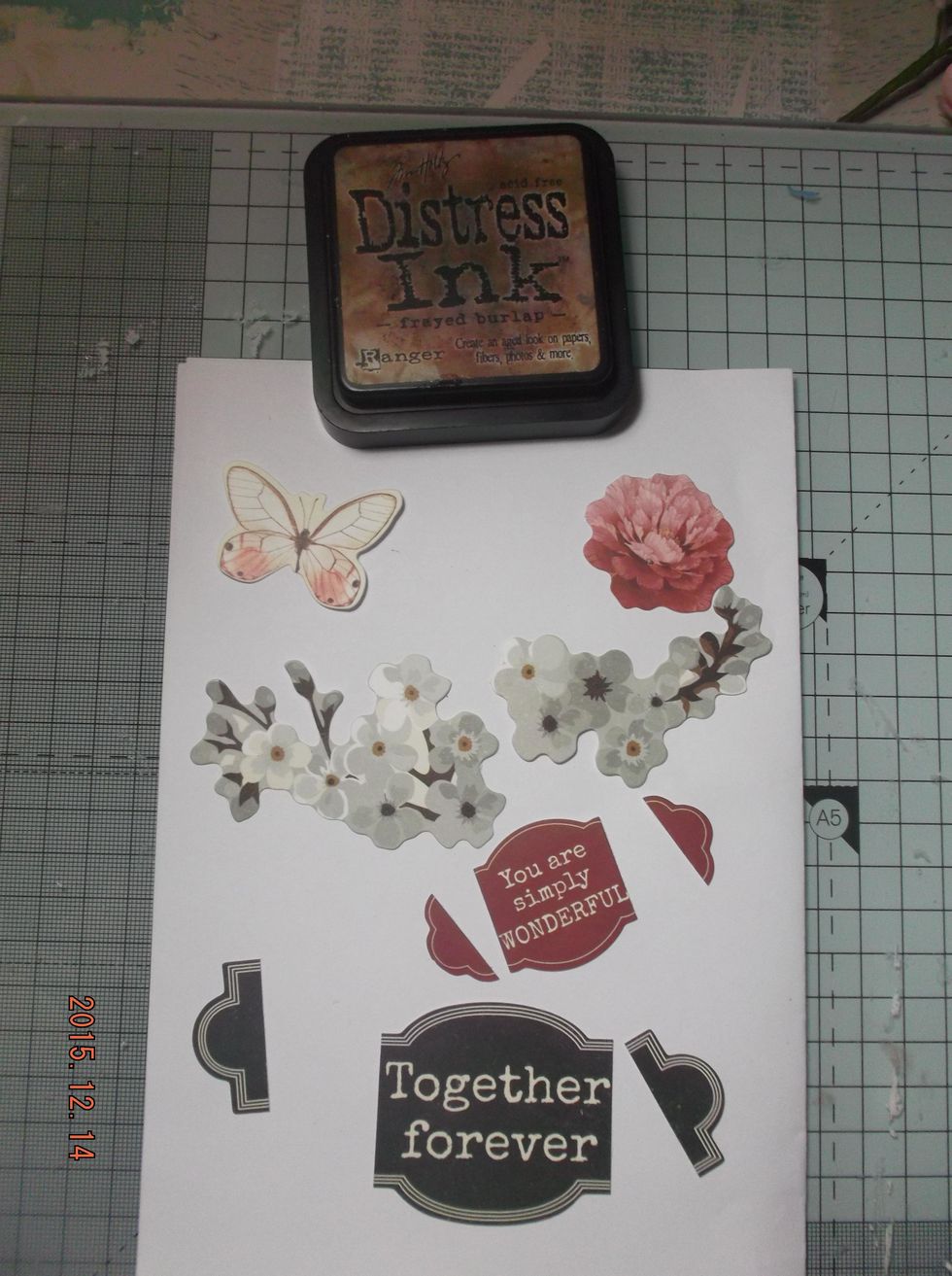 I chose the elements I wanted from the 'collectables'. Some I trimmed as i only wanted the ends. I inked the edges of all my papers and die-cuts with Distress ink Frayed Burlap.