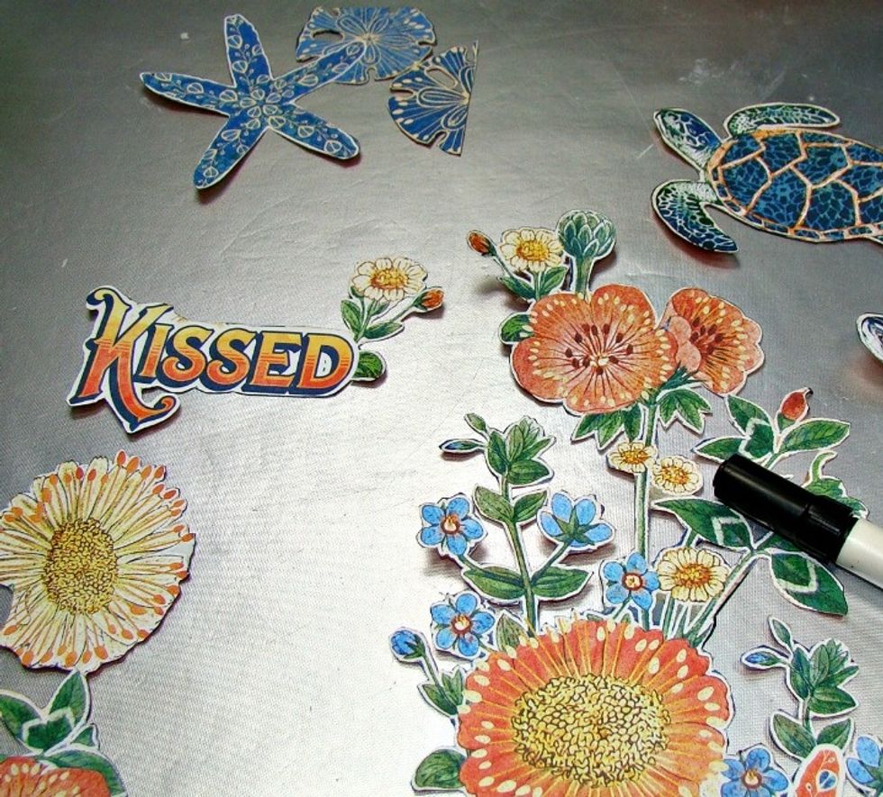 I chose these pretty G45 papers and fussy cut my images then took a black marker and ran over all the edges to get rid of the white. It really makes a huge difference when you fussy cut.