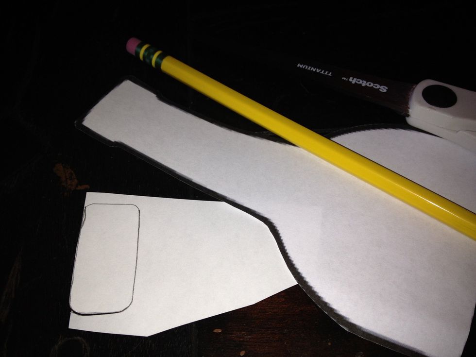 I chose to add a cork from a sheet of brown paper. I traced the top of my template and cut out.