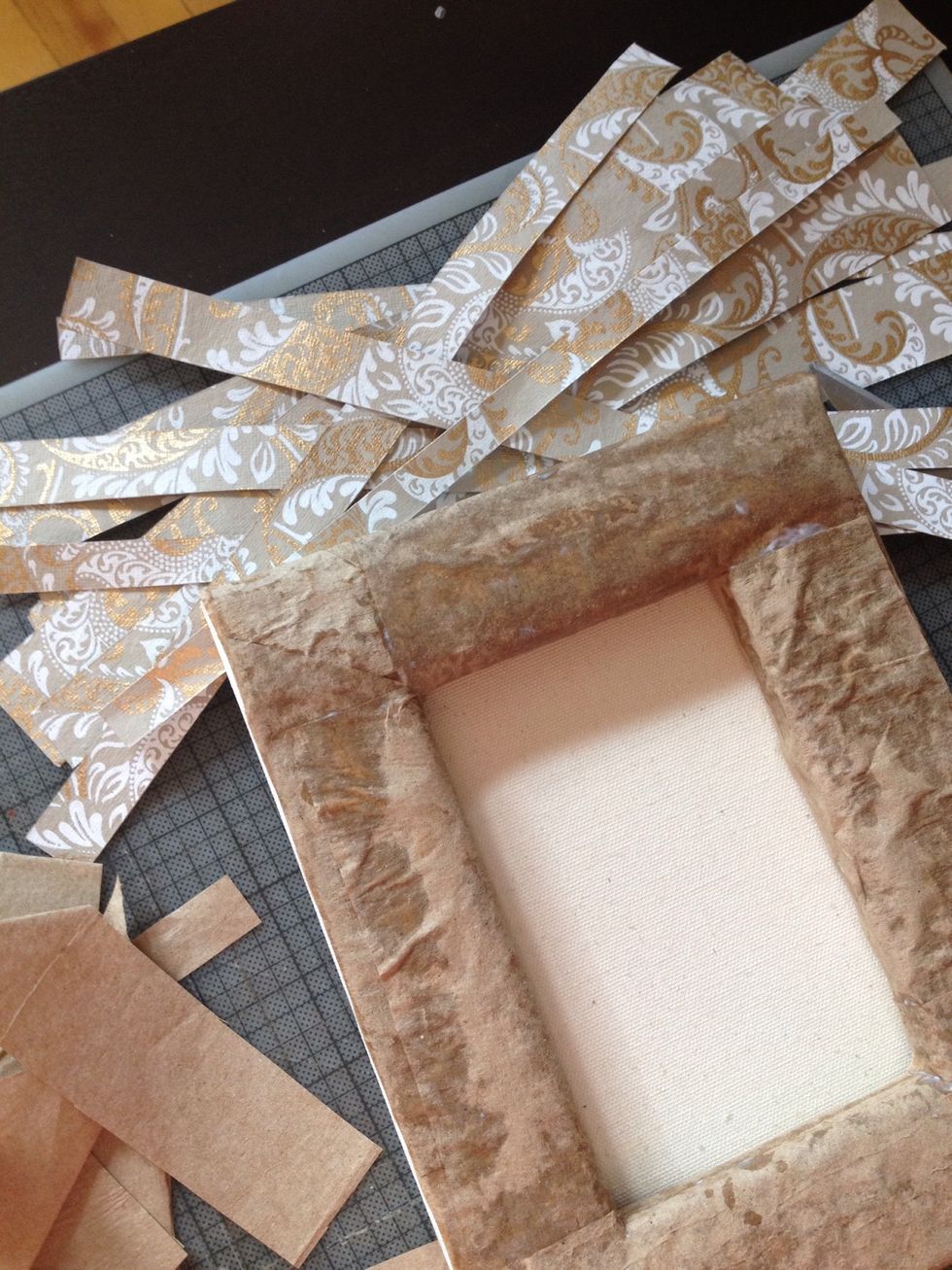 I chose to glued scrapbook paper to the back of the canvas