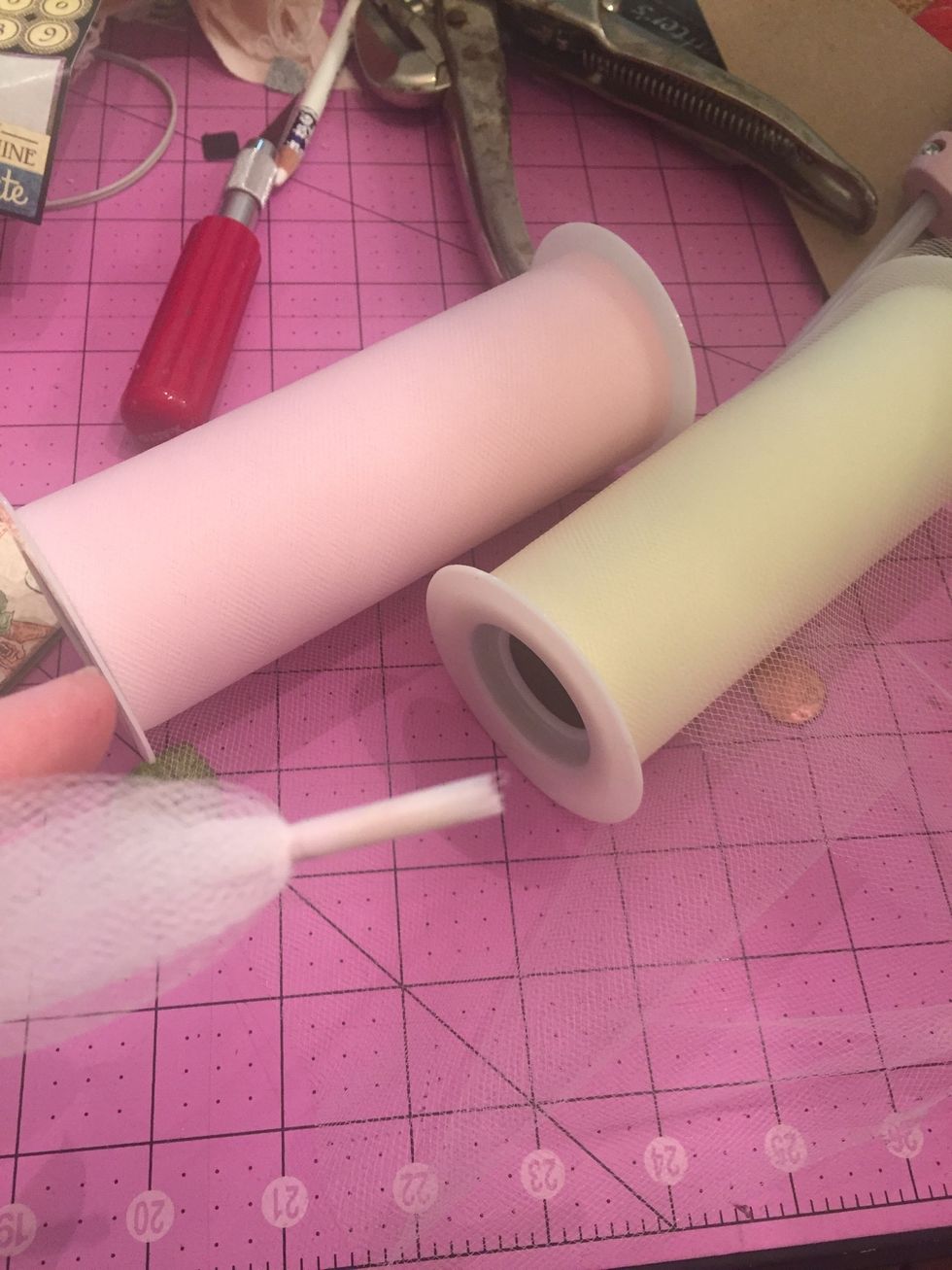 I chose two colors of 6in tulle. Put them together, wrap with tape on the end to help thread through the holes. If you don't have tulle, wired ribbon work great too