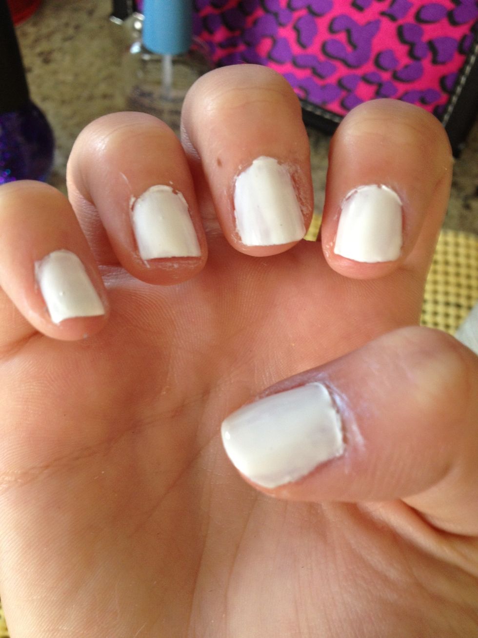 I chose white as my base color coat because it looked good underneath the glitter that im using and really made a pop. sorry so messy, I'm using my left hand;)