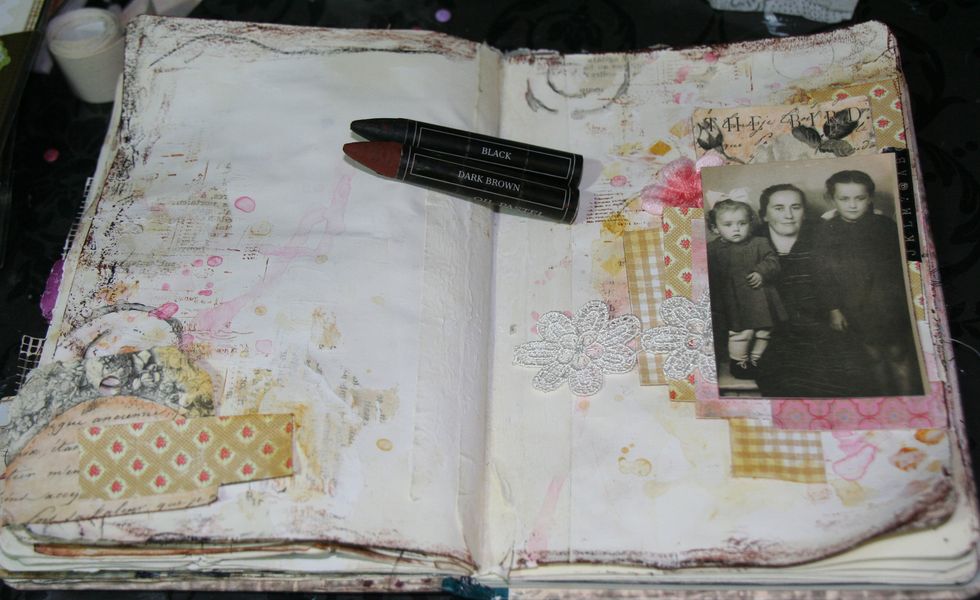 I colored all around my pages with Oil Pastel Black and Dark Brown.