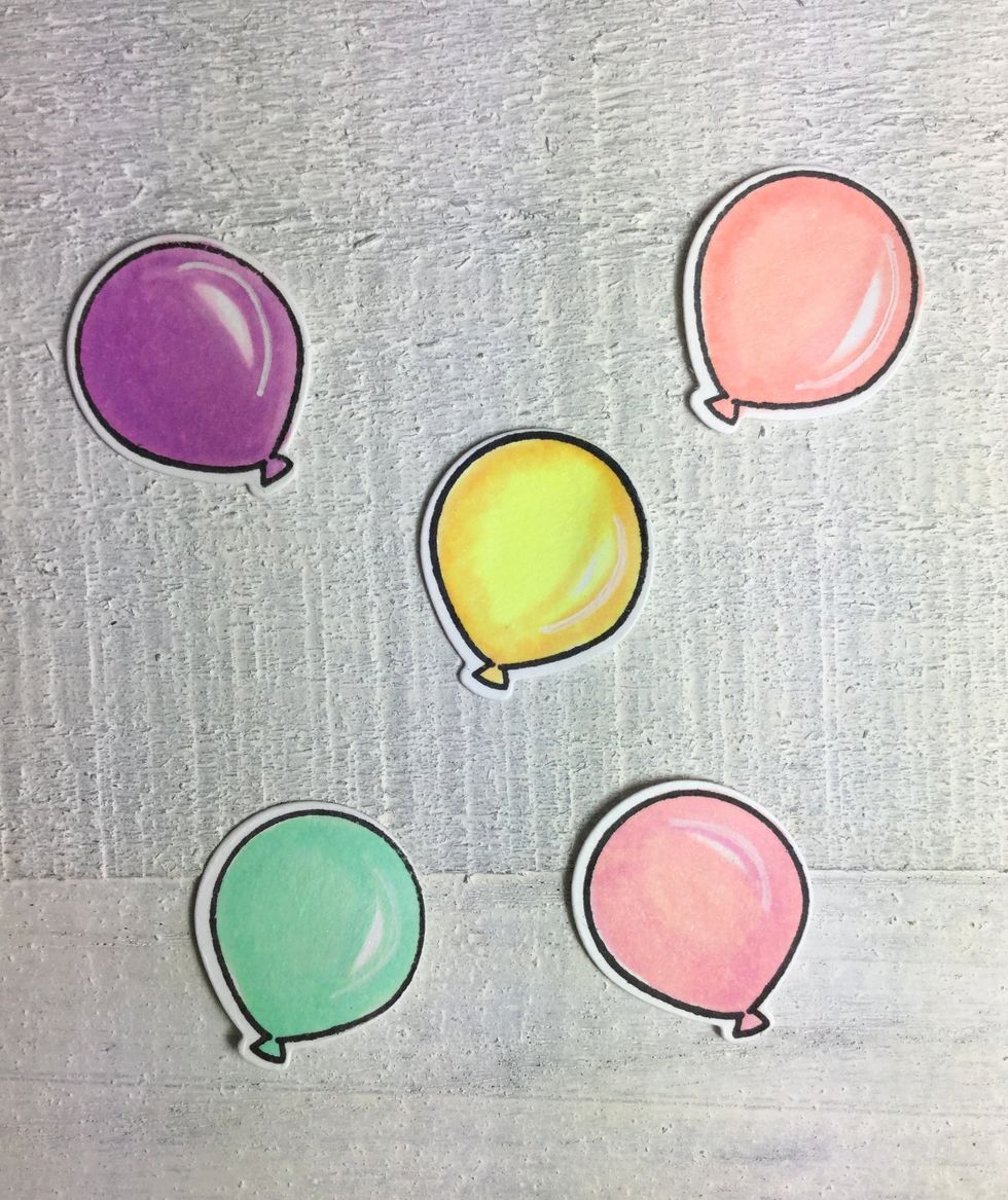 I colored the balloons in matching colors and highlighted them with a white gelly roll pen. I glittered them up with the Wink of Stella and ended up using only 3 of the balloons.