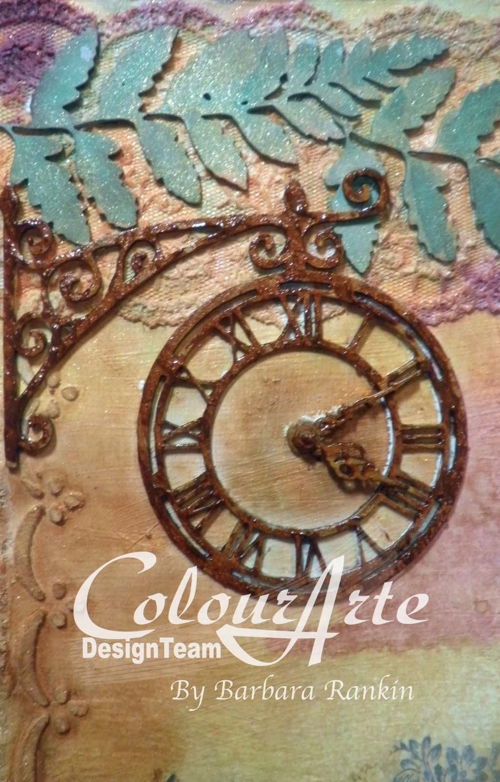 I colored the chipboard wall hanging clock and eyelet border with ColourArte Radiant Gels Autumn Leaf dimensional paint first, dabbing the paint for texture.