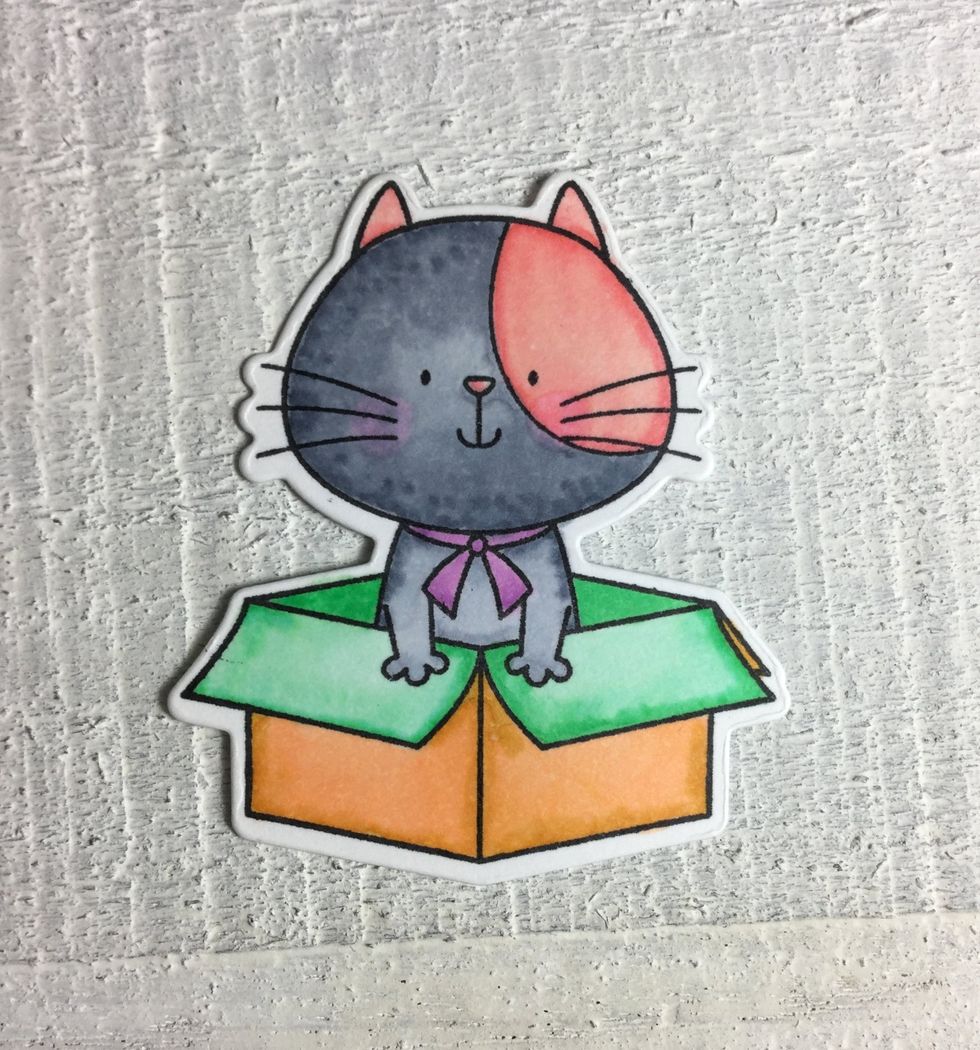 I colored the happy cat and the box with my Copic markers and had so much fun doing that.