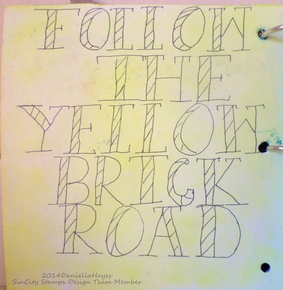 I colored the paper with yellow Pan Pastel and wrote "Follow The Yellow Brick Road" on it.