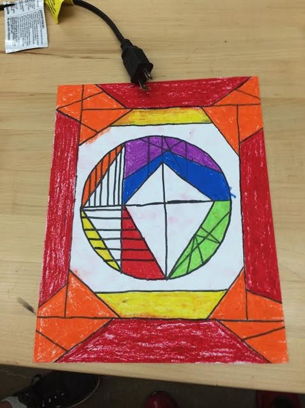I colored the rectangle border red. The triangles that connect together orange and the the trapezoids on the inside of the border yellow.