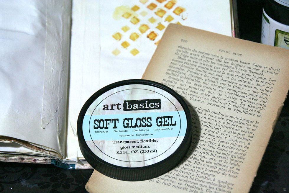 I continued on my background with old paper and Soft Gloss Gel.