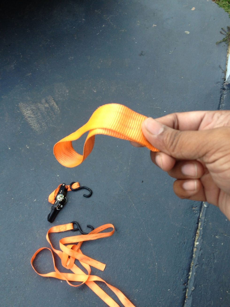 I cut about 12" off of one of my ratcheting straps and made it into a loop