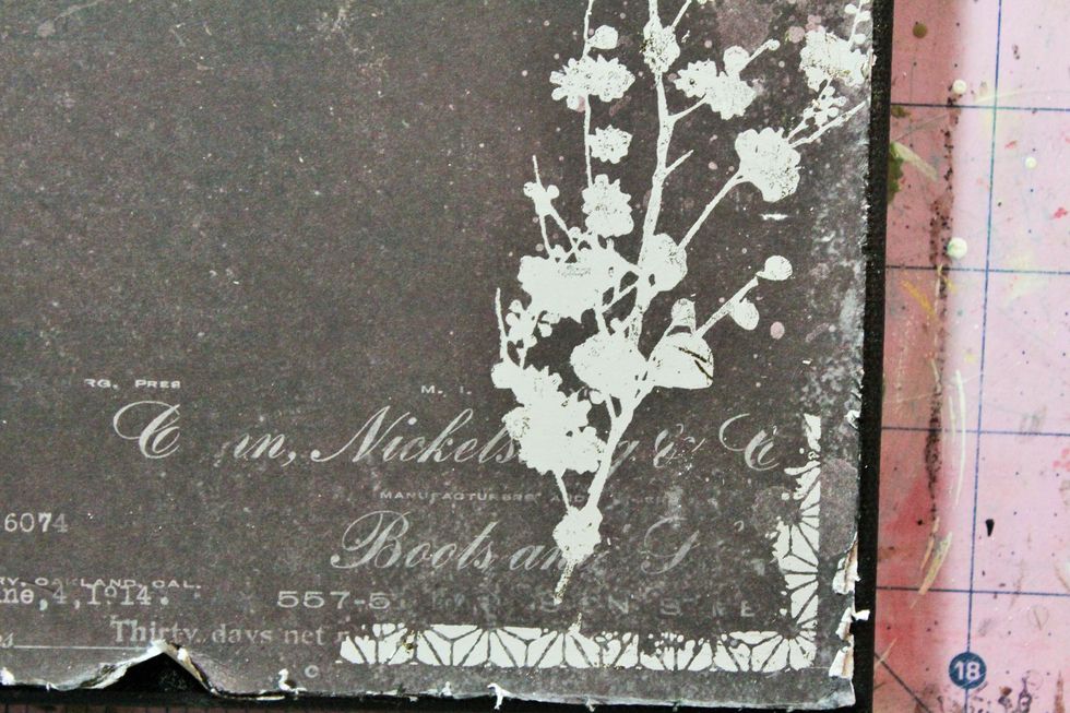 I cut apart pieces of the border piece of another rub on and used it around the corners and sides of the canvas.