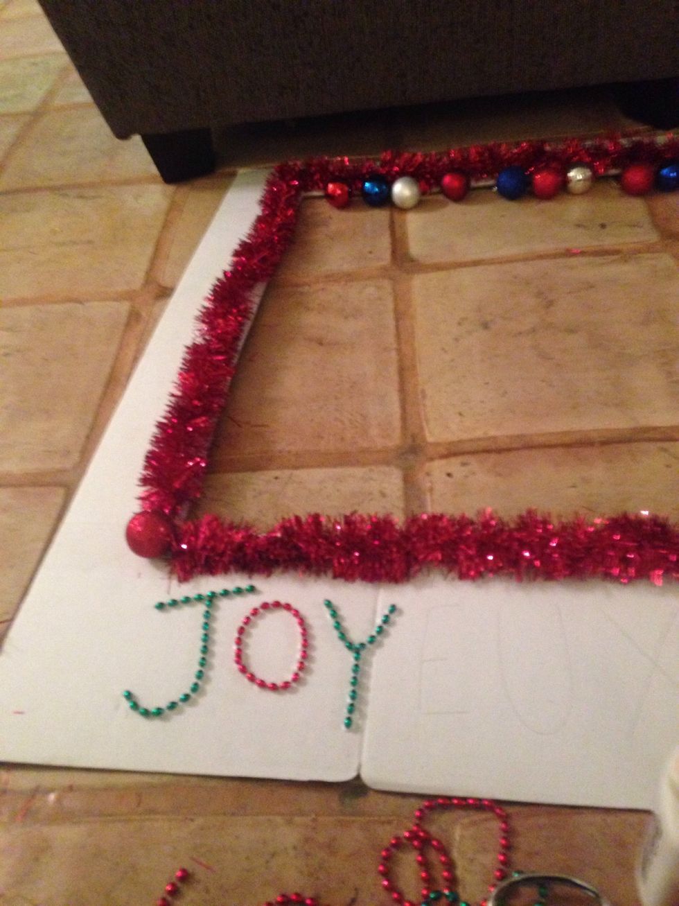 I cut bead necklaces to spell out Merry Christmas in French.