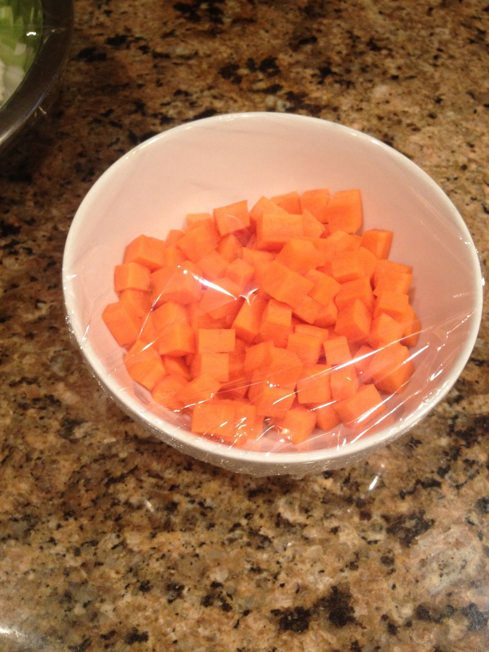 I cut my carrots into little cubes. Theres plastic wrap over them because i am preping an hour beforehand to make my life easier