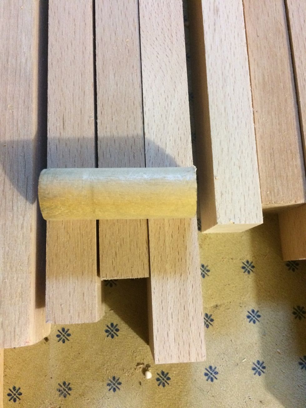 I cut my dowel into pieces that is a little smaller than the three pieces of wood.