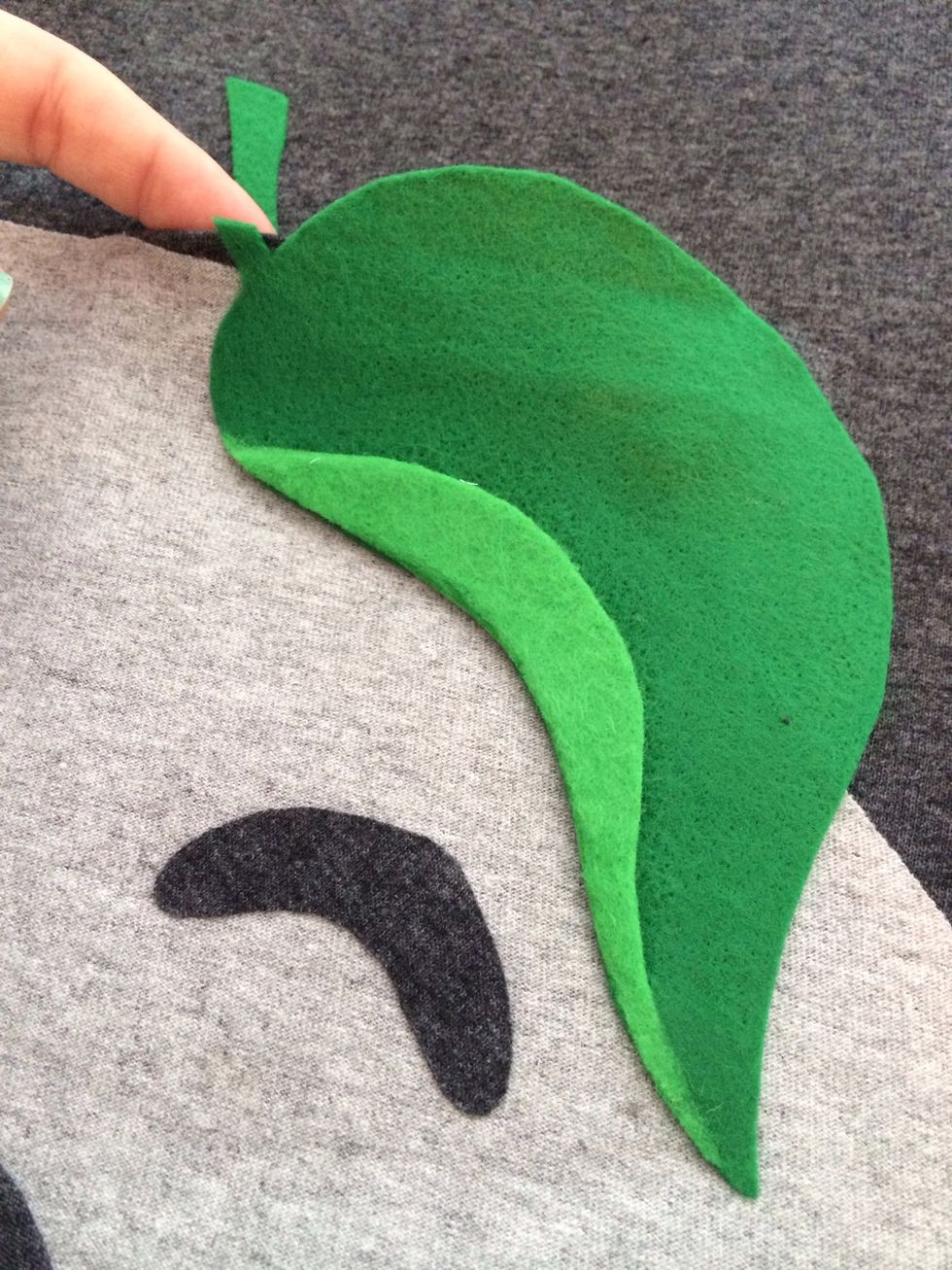 I cut off the extra felt that I used to back the top of the leaf. I ironed the stem down on the main shirt.