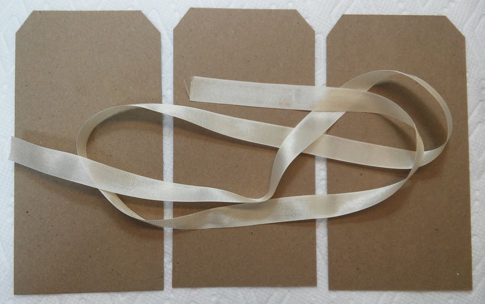 I cut some chipboard to base my tags on for pages. You'll need some ribbon too.