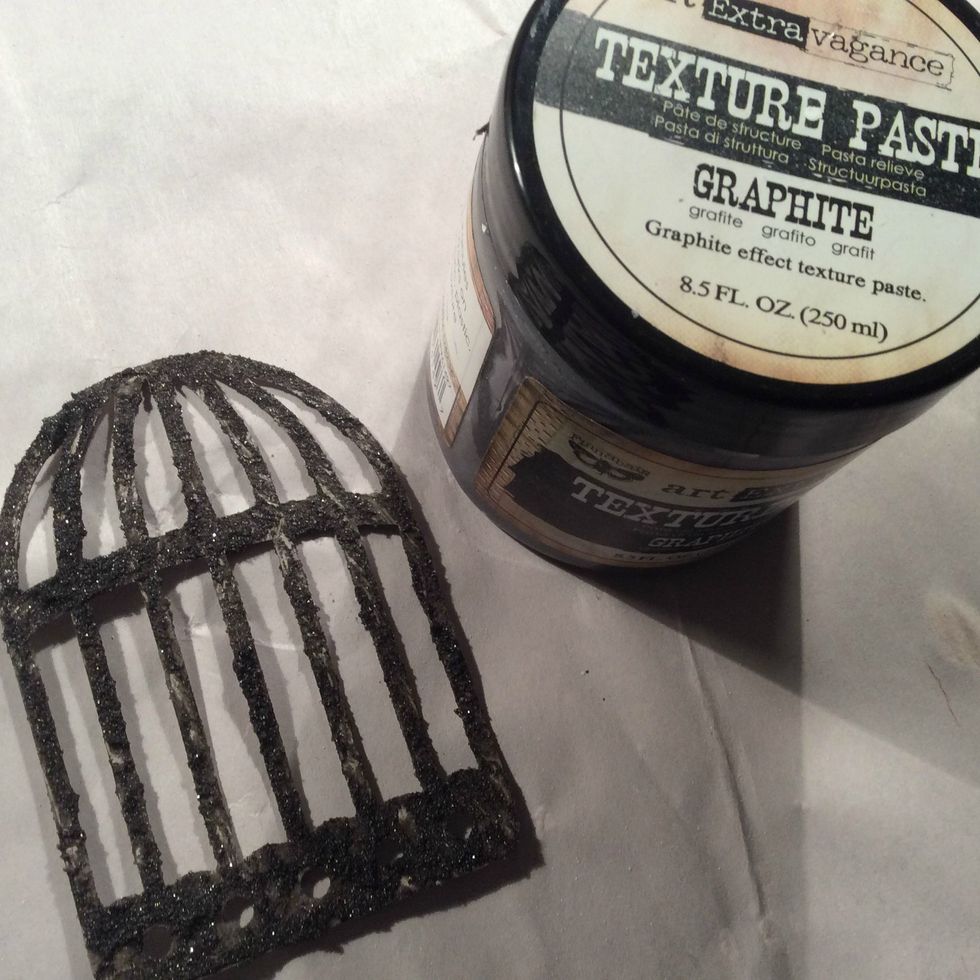 I cut the birdcage with my Sizzix diecut and gave it a coat of Texture Paste Graphite. Allow to dry completely.