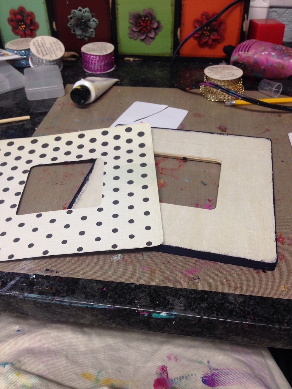 I cut the paper to fit the frame, then painted the edges of the frame that are uncovered with black paint