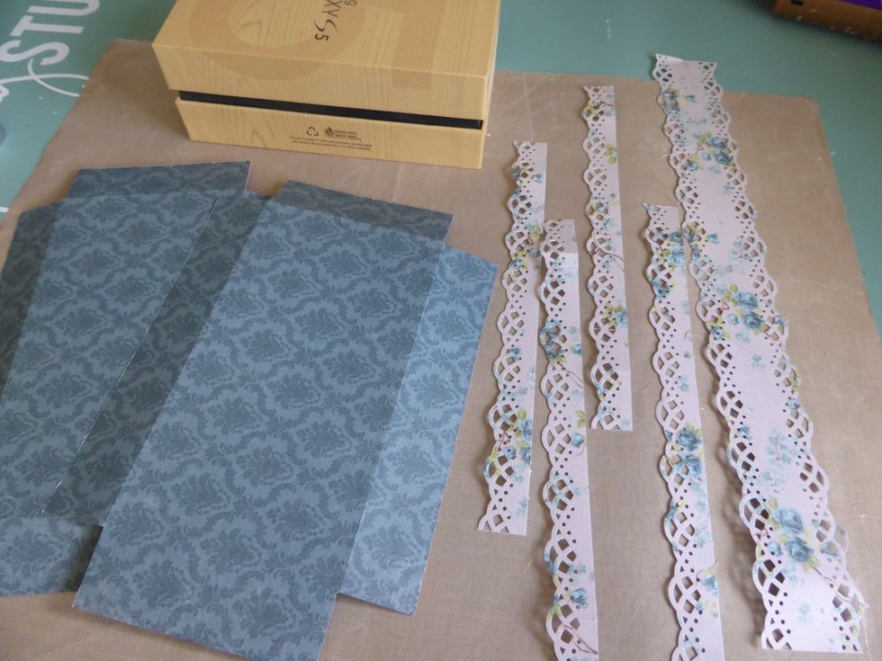 I cut the Pion Mister Tom's Treasures Morning Glory paper to fit the main surface of the box. Then I used a lace punch to make strips form the Tom's Garden paper