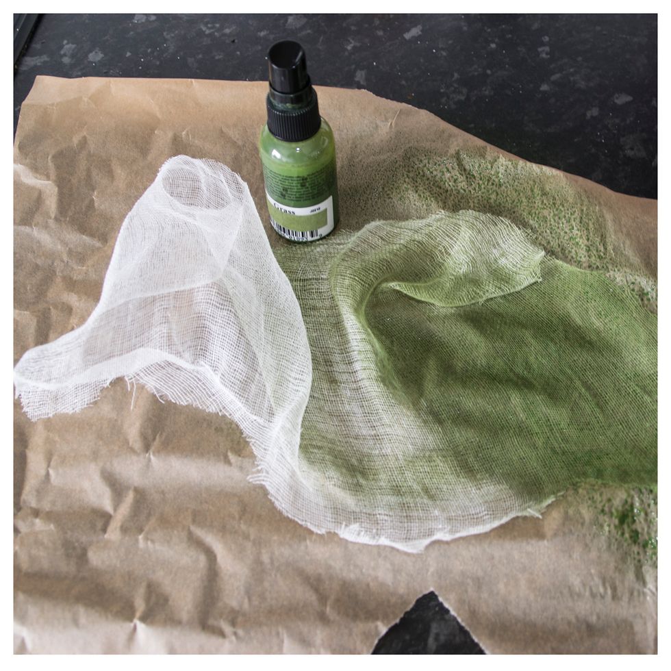 I cut up a piece of cheesecloth, and color it with some green mist. Hang it up to dry, or use a heat gun.