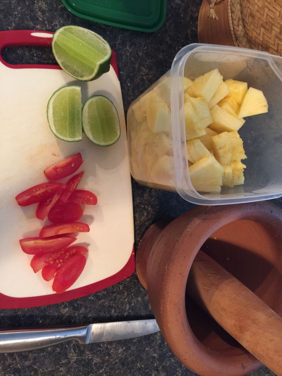 I cut up a pineapple into bite sized chunks. Also I cut 2 grape tomatoes into smaller pieces. I used a small pestle and mortar since I made enough for one person. \ud83d\ude00