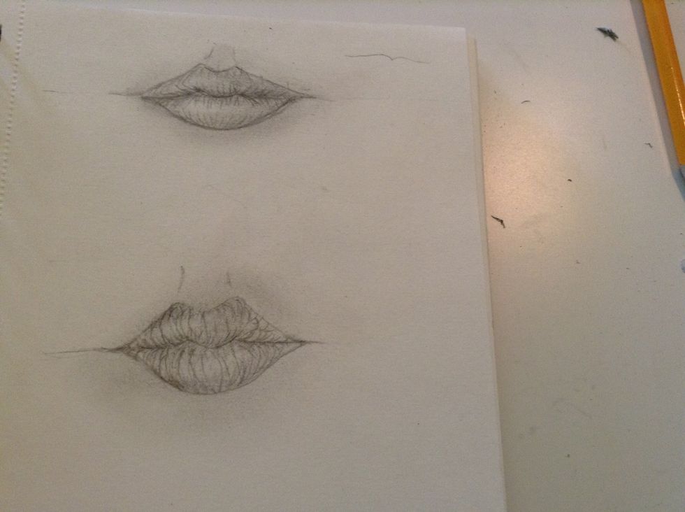 I'd recommend drawing different shapes of lips over and over again, to get used to it:)
