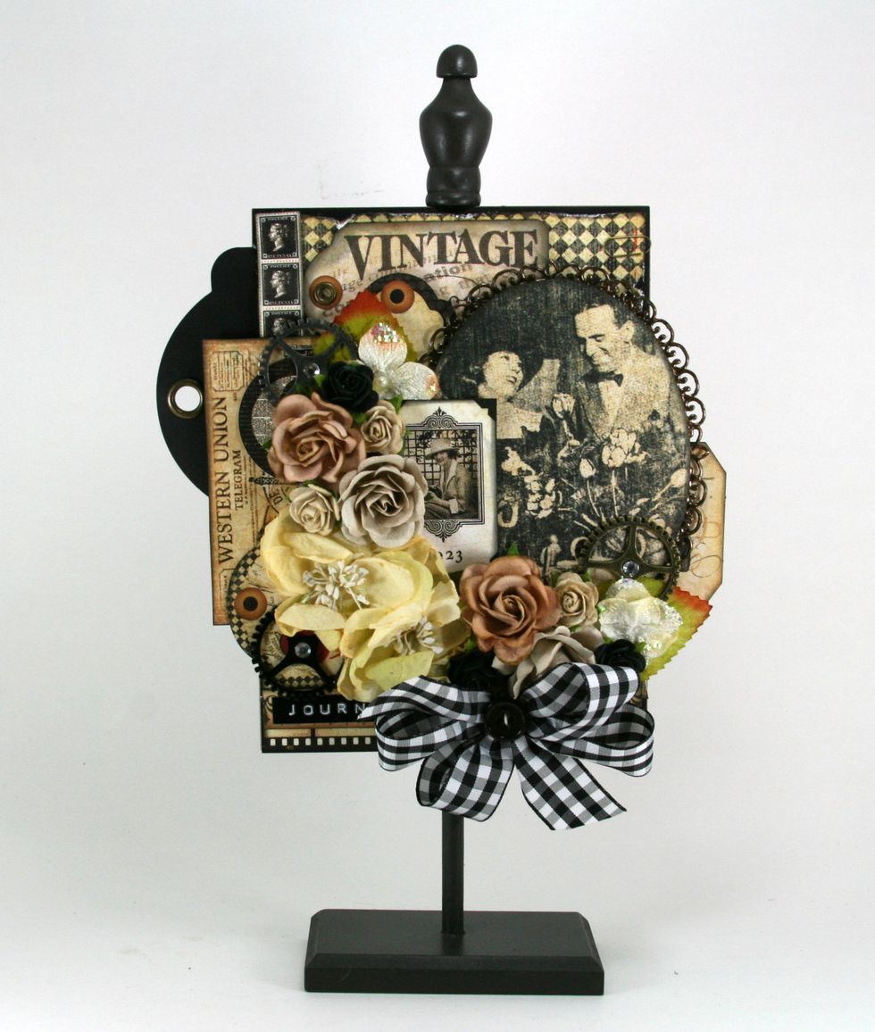 I decided after the arrangement was complete that the tag was sticking out more than I liked so I clipped it off and set it in a little more. I'm happy now that it doesn't offset the frame.