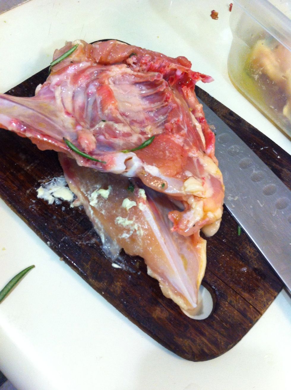 I decided I wanted to cut the breasts in half so they would cook through faster and realized that I first had to remove the bones - the part you throw away should look something like this