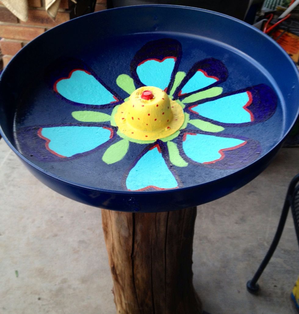 I decided the birds needed a big bird bath. Another log and this time I found an old charcoal grill. I sanded it and painted it and attached it to the log.