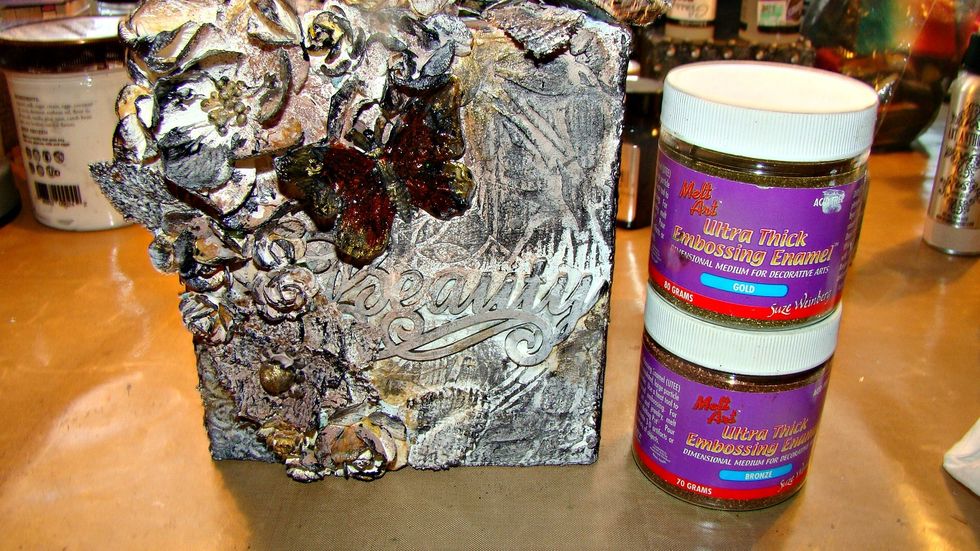 I decided to add a bit more bling, so I swiped the Versamark on top of the petals of some of the flowers and added Gold and Rust UTEE and then heat set.