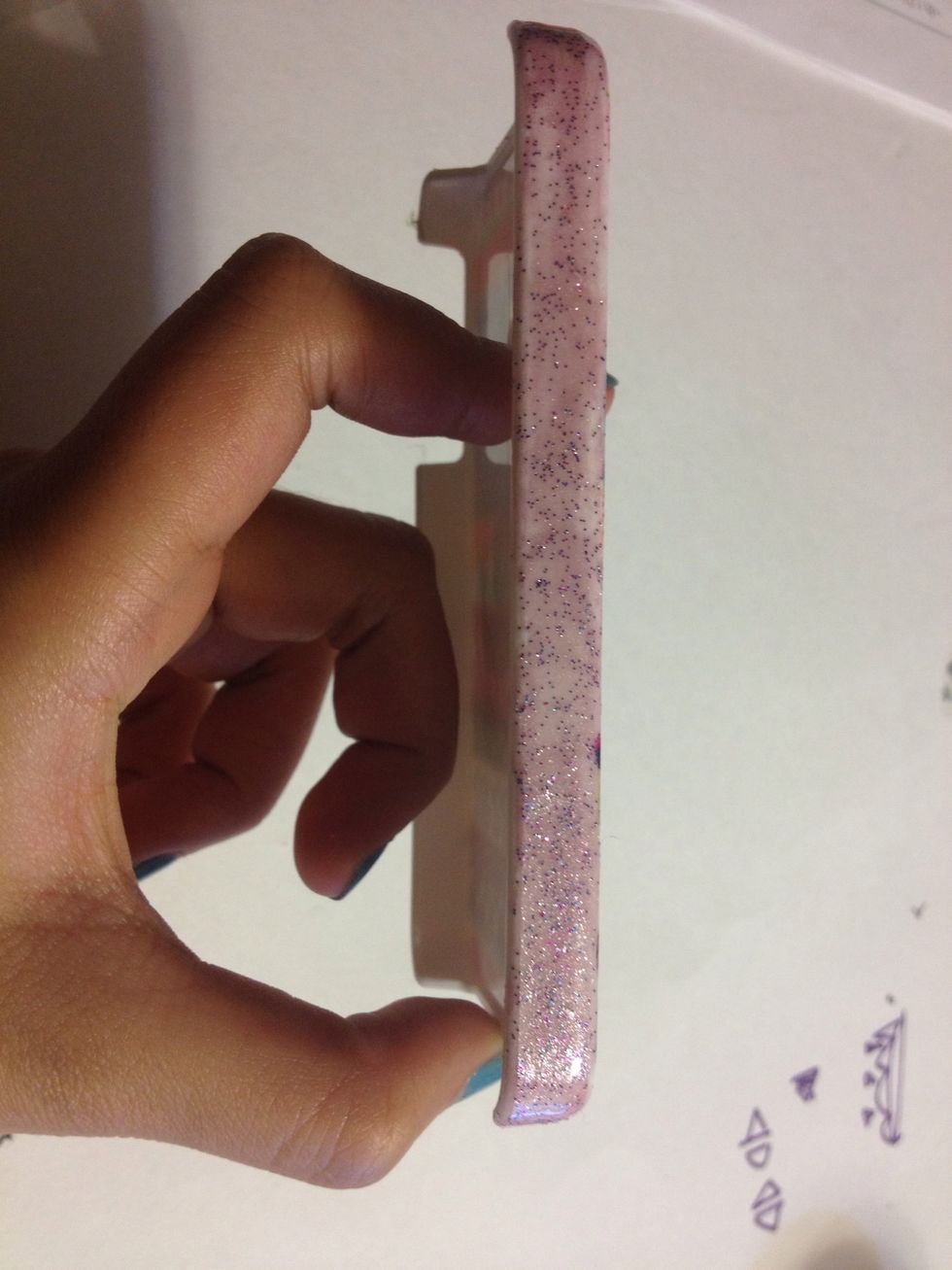 I decided to add sparkly nail polish on to each side. First I did the left side.