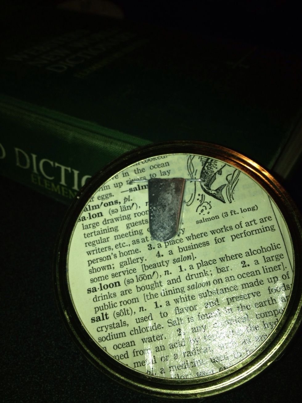 I decided to cover my lid with the page of an old dictionary that I keep on hand for art projects. You can leave yours plain or cover with fabric or paper, use Modpodge to glue it on & seal it.