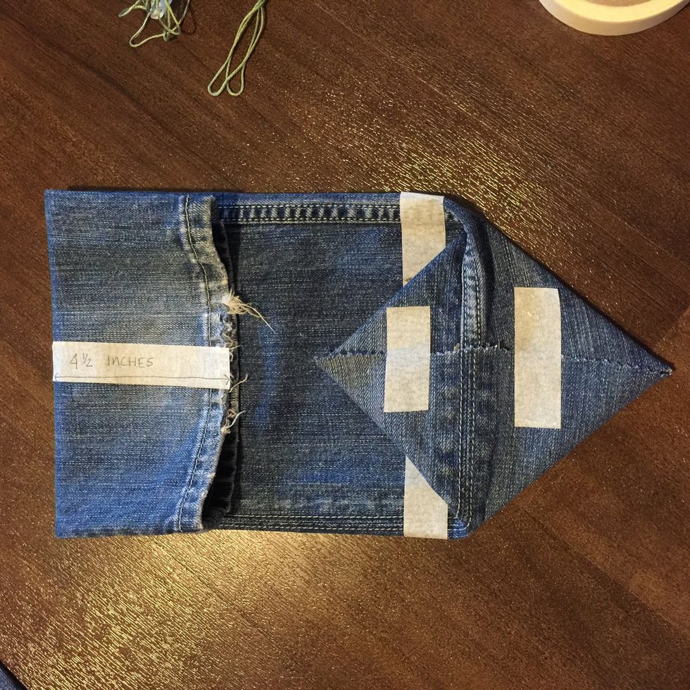 I decided to use the bottom of the pants as the top of my bag. So I turned the fabric around and with the cut side, I folded in the sides, like before.
